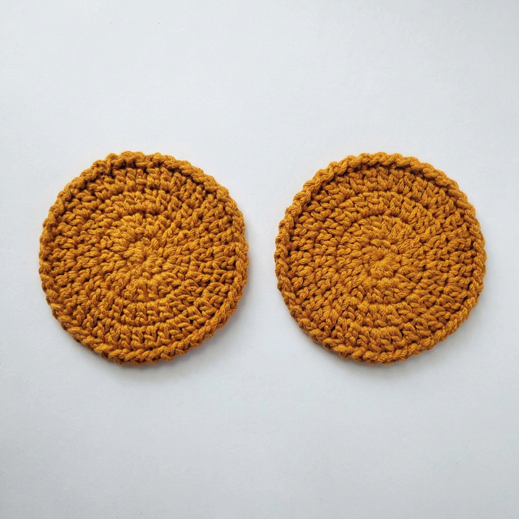 Mustard crochet coasters flat lay on a white table